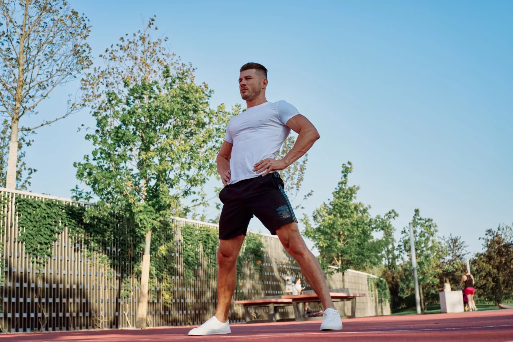 Man exercising outdoors in a field during workout session
